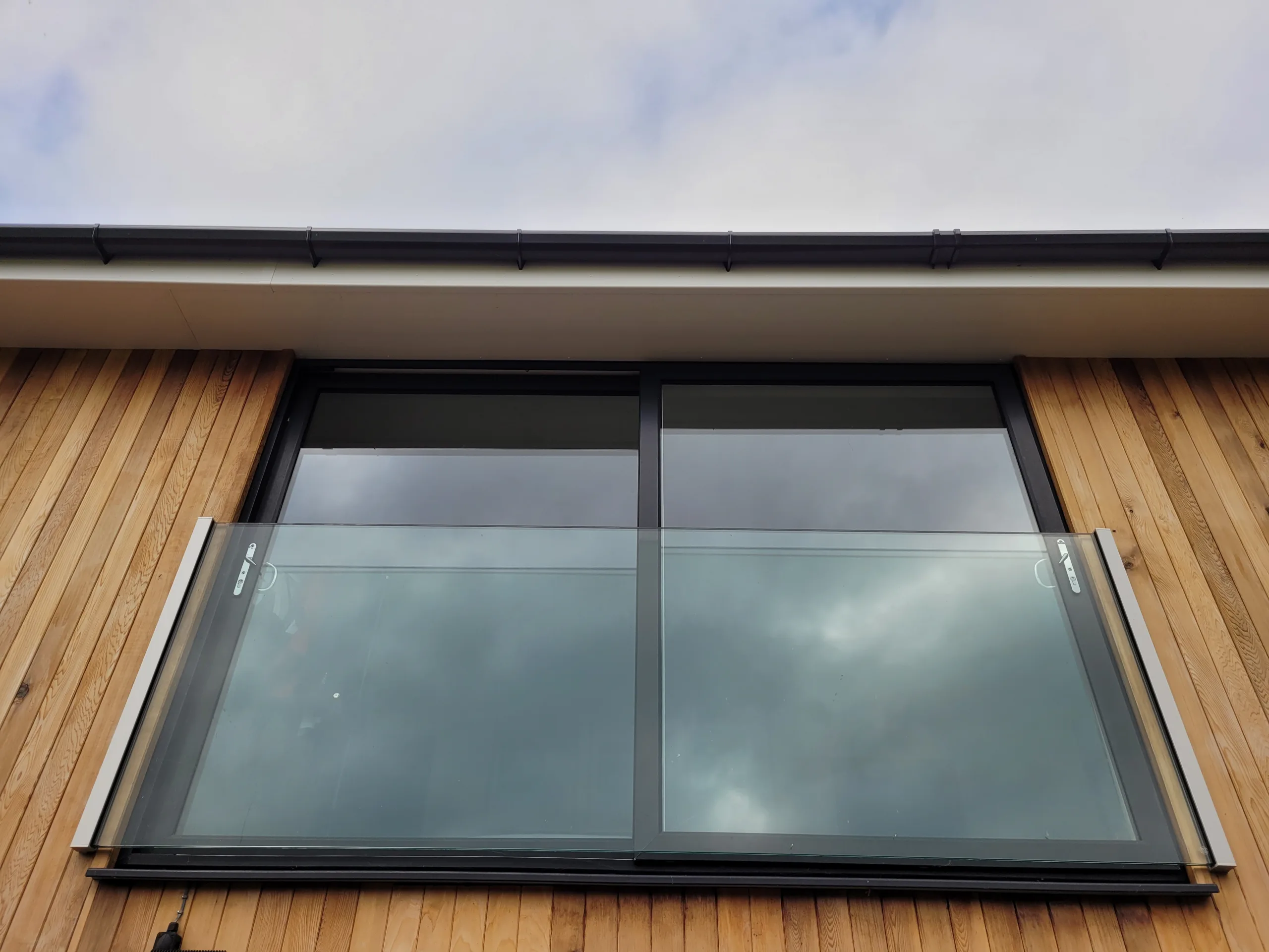Glass balustrade installation by WM Ironwork in Devon